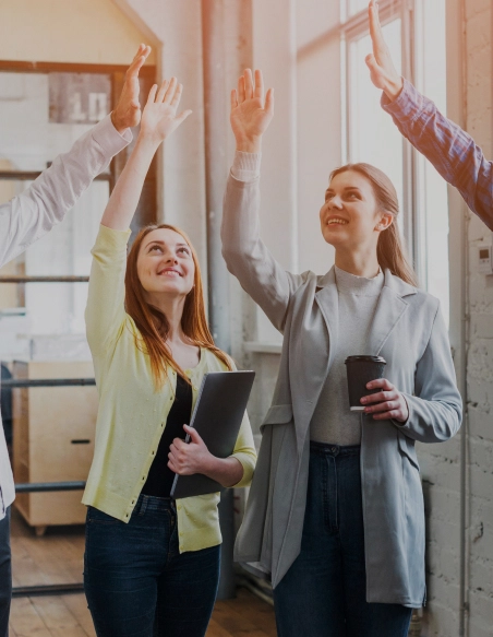 Vintazk Outsourcing employee giving a high five to celebrate the success of a digital marketing strategy.